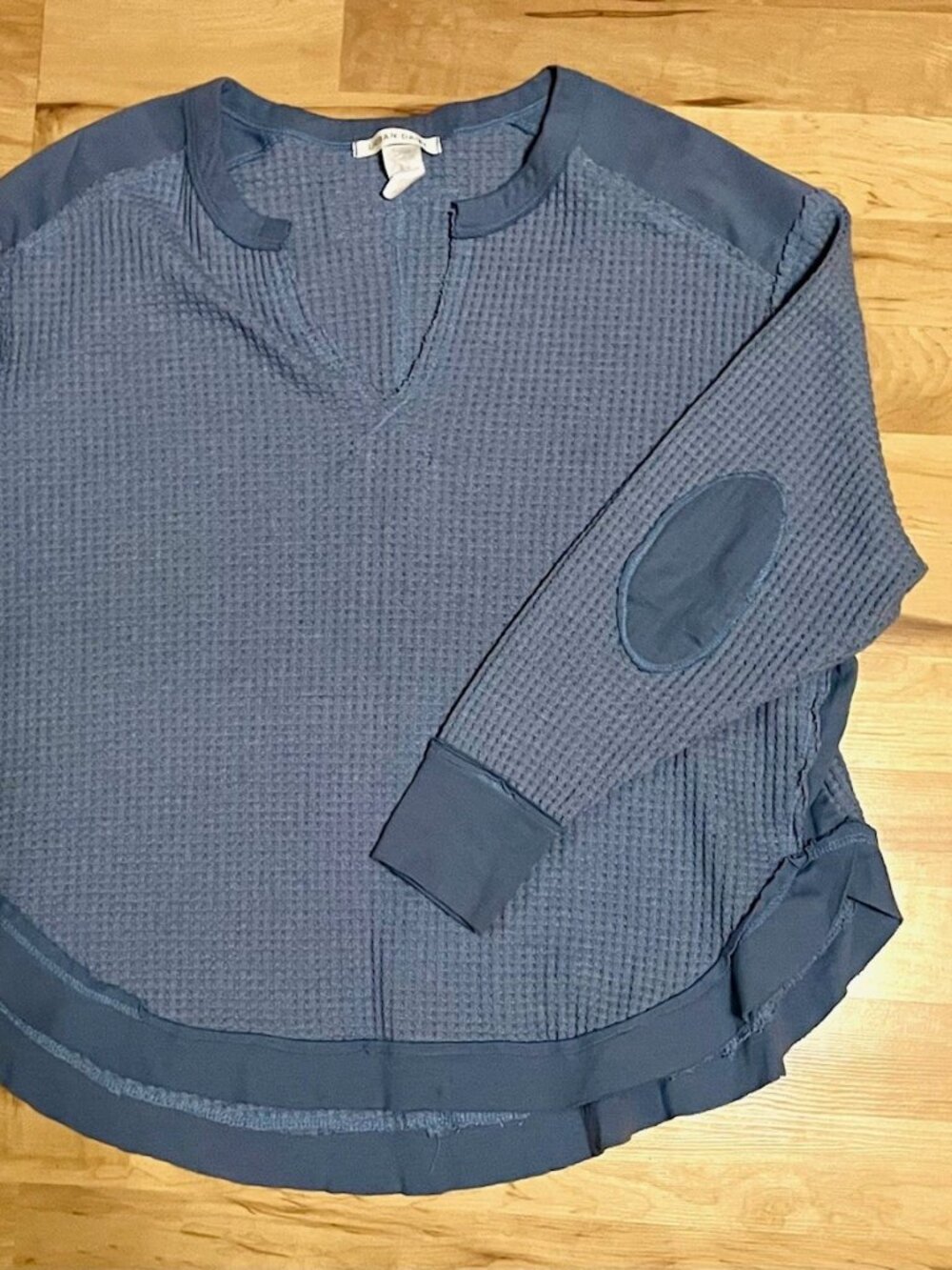 Cozy blue knit top with exposed-seam details & elbow patches! Medium.